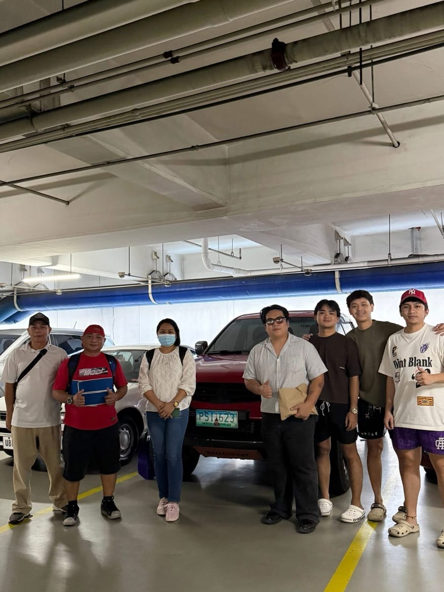 Family and buyers picking up their truck in the parking garage